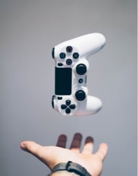 picture of a hand that is throwing a game pad